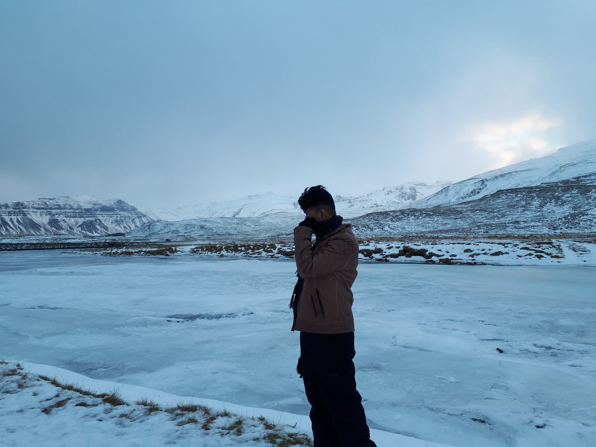 Gobi standing in a snowy mountain landscape at dusk